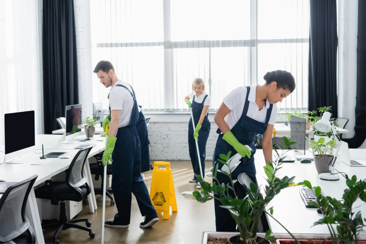 professional commercial janitorial services being performed in well lit office space