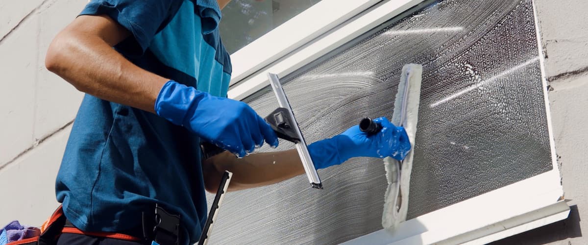 man cleaning windows